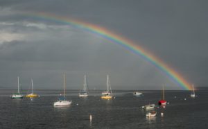 rainbow over boats in Bayside harbor