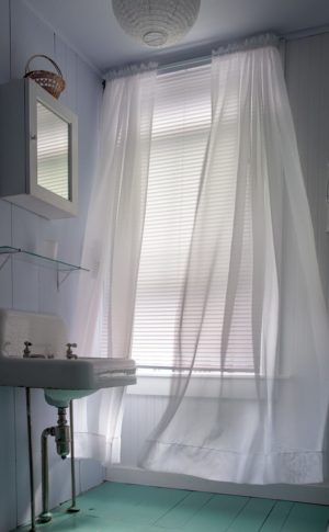 Soft breeze ruffles sheer curtain.