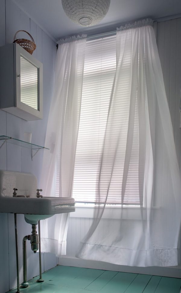 Soft breeze ruffles sheer curtain.
