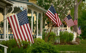 summer cottages each with an American flags